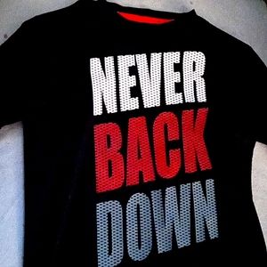 A shirt says never back down